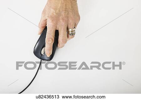 Senior businesswoman's hand using computer mouse View Large Photo Image Stock Image - Senior businesswoman's hand using computer mouse. Fotosearch