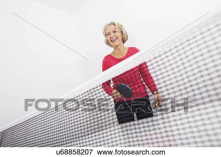 Senior female table tennis player laughing View Large Photo Image Stock Photo - Senior female table tennis player laughing. Fotosearch