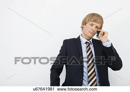 Senior mid adult businessman using cell phone over white background View Large Photo Image Stock Image - Senior mid adult businessman using cell phone over white background. Fotosearch