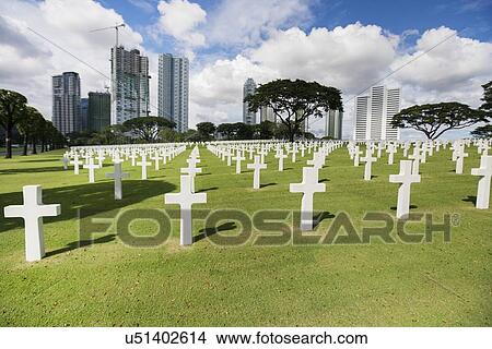 Picture - The American Memorial Cemetery with buildings in background, Manila, Philippines. Fotosearch