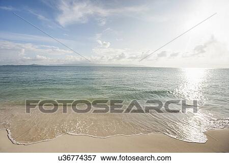 Water's edge on beach, Koh Pha Ngan, Thailand View Large Photo Image Stock Photo - Water's edge on beach, Koh Pha Ngan, Thailand. Fotosearch