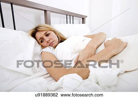 Woman suffering from abdomen pain in bed View Large Photo Image Stock Image - Woman suffering from abdomen pain in bed. Fotosearch