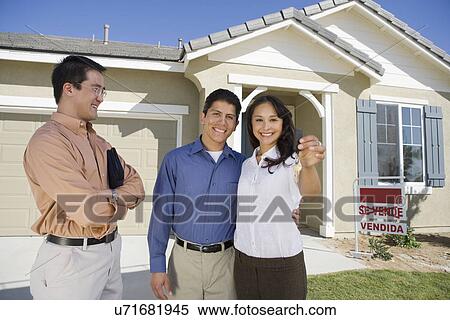 Young couple buying house holding keys View Large Photo Image Stock Photography - Young couple buying house holding keys. Fotosearch