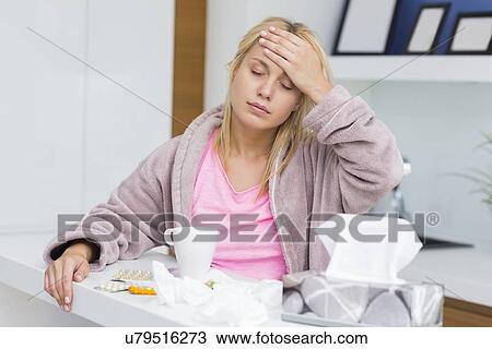 Young woman suffering from headache and cold View Large Photo Image Stock Image - Young woman suffering from headache and cold. Fotosearch