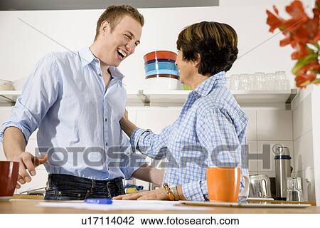 Adult grandson and grandmother having fun at home View Large Photo Image Stock Image - Adult grandson and grandmother having fun at home. Fotosearch