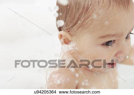 Baby splashing in bathtub View Large Photo Image Picture - Baby splashing in bathtub. Fotosearch