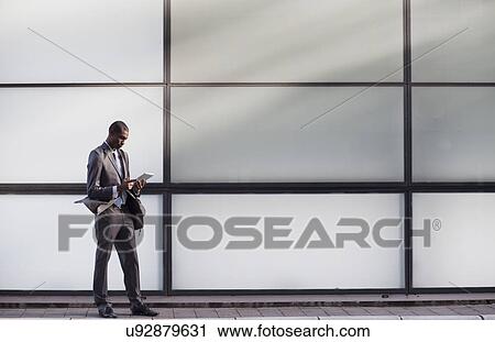 Businessman using digital tablet View Large Photo Image Stock Image - Businessman using digital tablet. Fotosearch