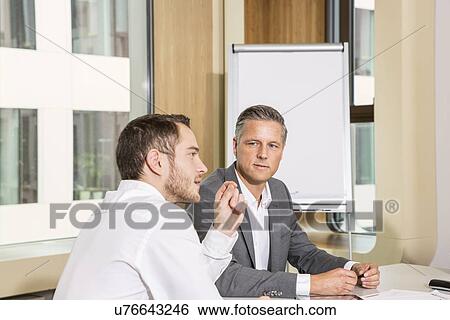 Businessmen meeting in conference room View Large Photo Image Stock Photograph - Businessmen meeting in conference room. Fotosearch