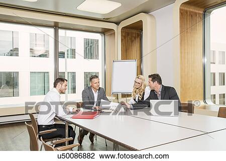 Businesspeople meeting in conference room View Large Photo Image Stock Image - Businesspeople meeting in conference room. Fotosearch