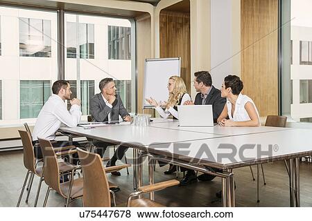 Businesspeople meeting in conference room View Large Photo Image Stock Photo - Businesspeople meeting in conference room. Fotosearch