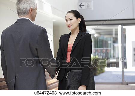 Businesspeople shaking hands View Large Photo Image Stock Image - Businesspeople shaking hands. Fotosearch