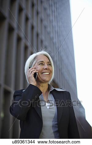 Businesswoman making phone call View Large Photo Image Picture - Businesswoman making phone call. Fotosearch