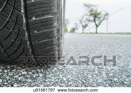 Car tire on road, close up View Large Photo Image Stock Photo - Car tire on road, close up. Fotosearch