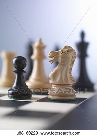 Stock Photo - Chess game, player preparing to check mate. Fotosearch