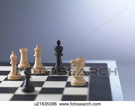 Stock Photograph - Chess game, player preparing to check mate. Fotosearch