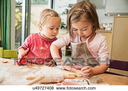 Stock Photo - Children baking in kitchen. Fotosearch