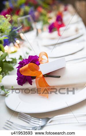 Stock Image - Close up detail of place settings at wedding reception. Fotosearch