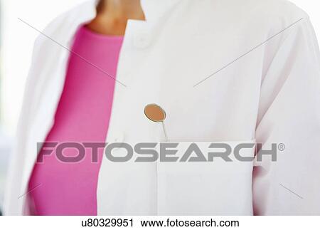 Close up of dental mirror in dentists pocket View Large Photo Image Stock Image - Close up of dental mirror in dentists pocket. Fotosearch