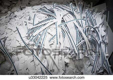 Stock Photography - Close up of discarded strips of paper in printing workshop. Fotosearch