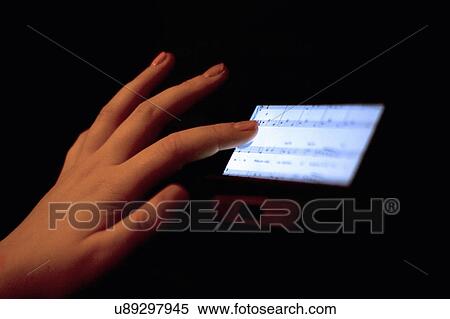 Close up of hand using touchscreen displaying sheet music View Large Photo Image Stock Photography - Close up of hand using touchscreen displaying sheet music. Fotosearch