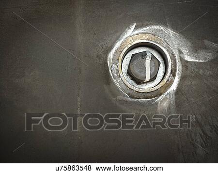 Stock Photo - Close up of steel nut in factory. Fotosearch