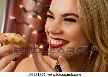 Close up of young woman with mince pie View Large Photo Image Stock Photography - Close up of young woman with mince pie. Fotosearch