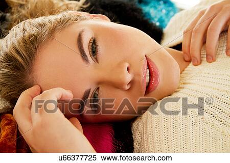 Close up portrait of young woman lying on furry blanket View Large Photo Image Stock Photography - Close up portrait of young woman lying on furry blanket. Fotosearch