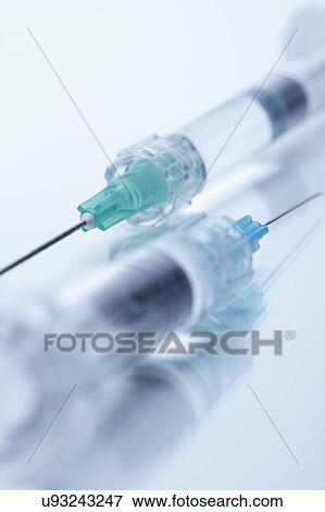 Stock Photo - Close up studio shot of two hypodermic needles. Fotosearch