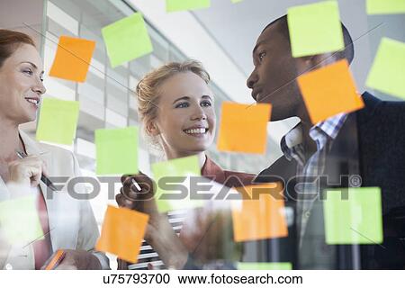 Colleagues brainstorming using adhesive notes View Large Photo Image Stock Image - Colleagues brainstorming using adhesive notes. Fotosearch
