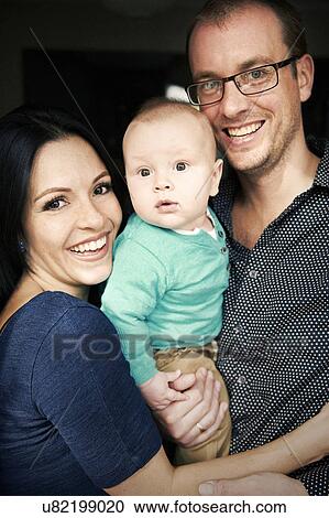 Stock Image - Couple with baby boy. Fotosearch
