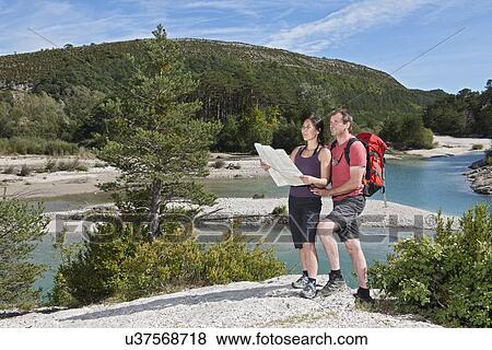 Couple with map, Canyon du Verdon, Provence, France View Large Photo Image Stock Photo - Couple with map, Canyon du Verdon, Provence, France. Fotosearch