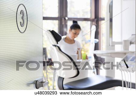Stock Image - Dental nurse working in dentists. Fotosearch