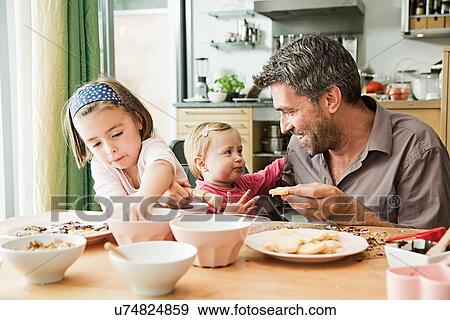 Father and children baking in kitchen View Large Photo Image Stock Photo - Father and children baking in kitchen. Fotosearch