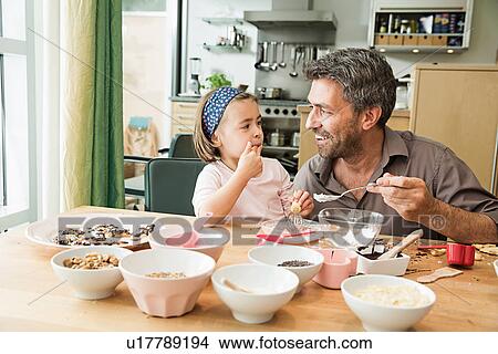Father and daughter baking in kitchen View Large Photo Image Picture - Father and daughter baking in kitchen. Fotosearch