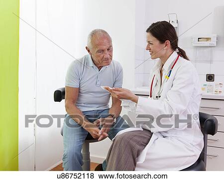 Female doctor talking to senior male patient View Large Photo Image Stock Photo - Female doctor talking to senior male patient. Fotosearch