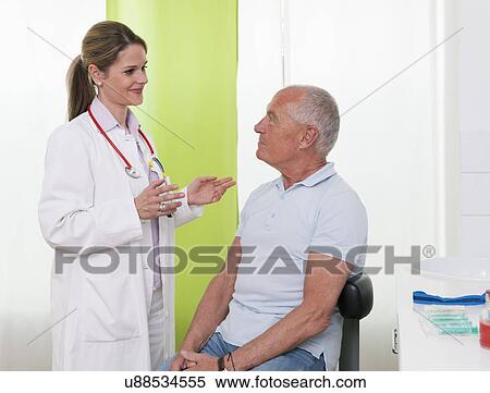 Female doctor talking to senior male patient View Large Photo Image Stock Photography - Female doctor talking to senior male patient. Fotosearch