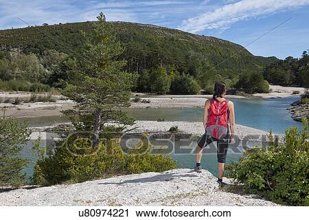 Stock Image - Female hiker admiring view, Canyon du Verdon, Provence, France. Fotosearch