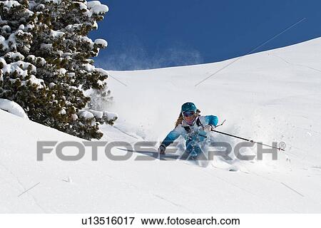 Stock Photo - Female skiing off-piste in Kuhtai, Austria. Fotosearch