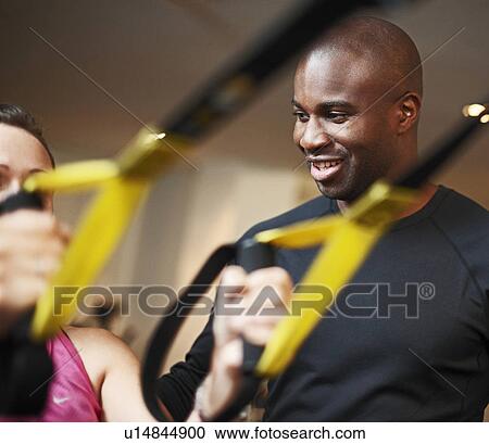 Stock Image - Fitness instructor and woman. Fotosearch