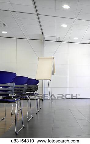 Flipchart and blue chairs in conference room View Large Photo Image Stock Image - Flipchart and blue chairs in conference room. Fotosearch