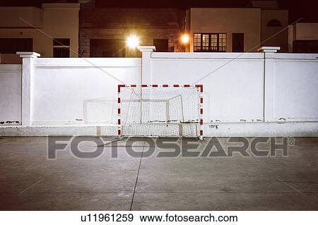 Football goal by wall at night View Large Photo Image Stock Photo - Football goal by wall at night. Fotosearch