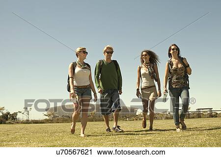 Four friends walking in park, Cape Town, South Africa View Large Photo Image Stock Image - Four friends walking in park, Cape Town, South Africa. Fotosearch