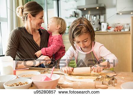 Girl baking in kitchen View Large Photo Image Stock Photo - Girl baking in kitchen. Fotosearch