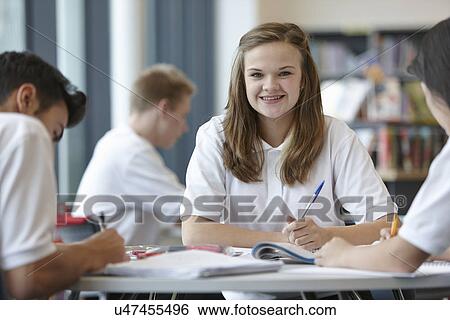 Group of teenagers working in school classroom View Large Photo Image Stock Photograph - Group of teenagers working in school classroom. Fotosearch