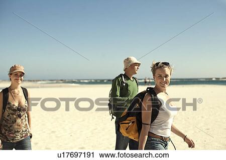 Group of young adult friends on beach, Cape Town, South Africa View Large Photo Image Stock Image - Group of young adult friends on beach, Cape Town, South Africa. Fotosearch