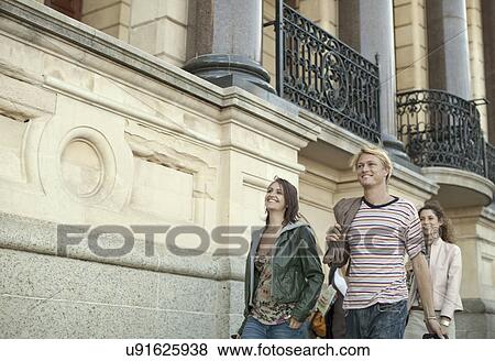 Group of young adults walking on pavement, Cape Town, South Africa View Large Photo Image Stock Photo - Group of young adults walking on pavement, Cape Town, South Africa. Fotosearch