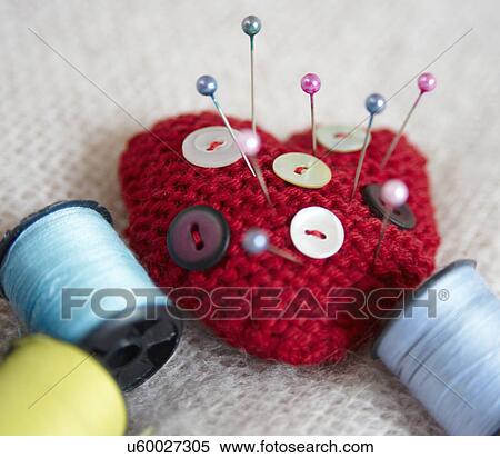Heart-shaped pin cushion. buttons and thread View Large Photo Image Stock Photography - Heart-shaped pin cushion. buttons and thread. Fotosearch