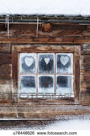 Hearts on window of log cabin, Austrian Alps, Austria View Large Photo Image Stock Photograph - Hearts on window of log cabin, Austrian Alps, Austria. Fotosearch
