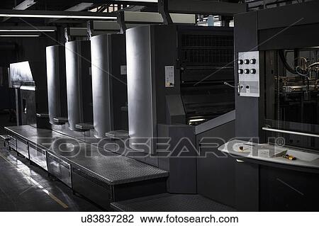 Stock Image - Hi tech printing equipment in print workshop. Fotosearch
