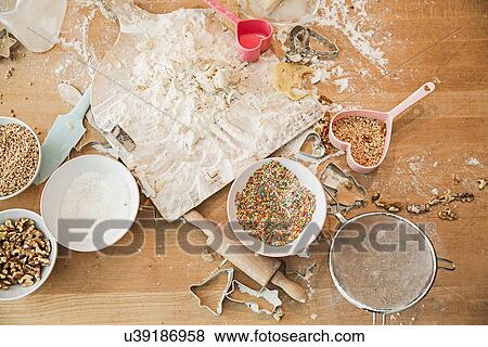 Stock Photo - Ingredients, baking mold, bowls, rolling pin, sieve. Fotosearch